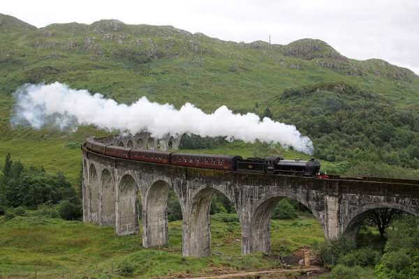 The Jacobite crossing Glenfinnan Viaduct, Scotland
